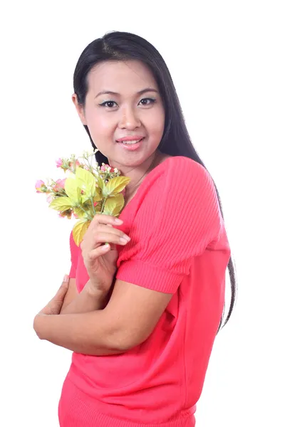 Young woman holding artificial flower, isolated on white backgr — Stock Photo, Image