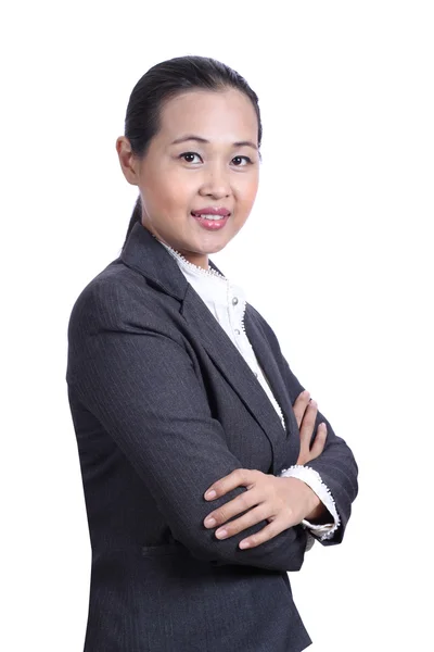 Portrait of a smiling young businesswoman with arms crossed — Stock Photo, Image