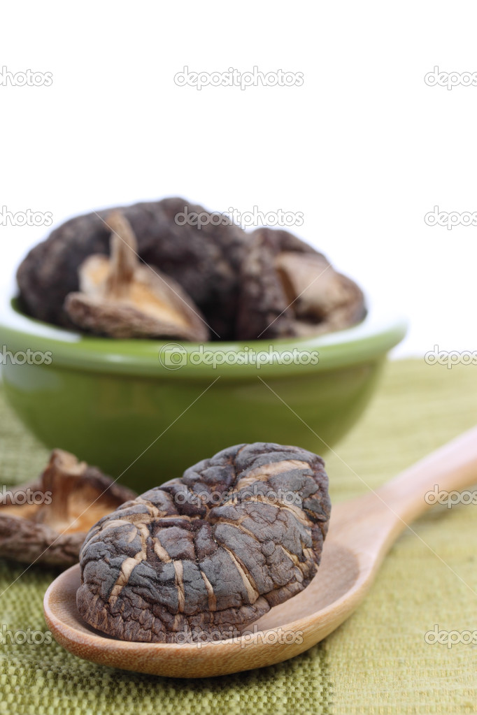 Dried Shiitake Mushrooms with wooden spoon