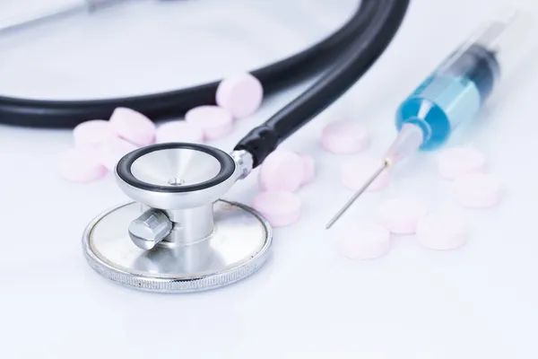 Medical, pills, syringe and stethoscope — Stock Photo, Image