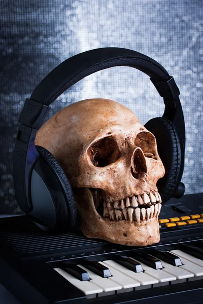 Human skull with earphones