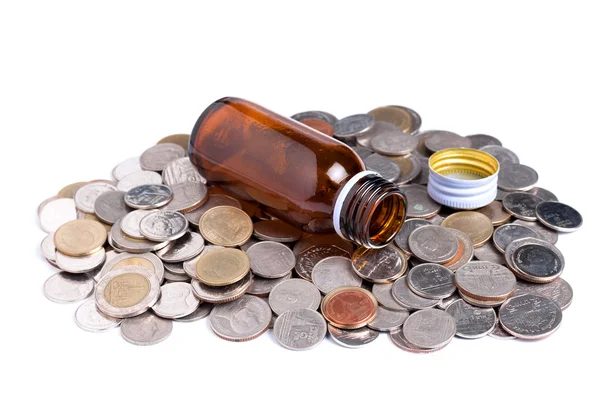 Medcine bottle with coins — Stock Photo, Image