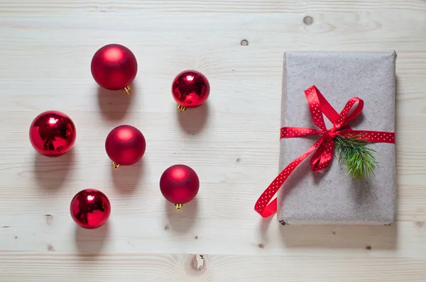 Red christmas ball and gift — Stock Photo, Image