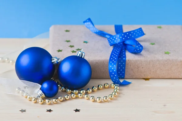 Blue cristmas balls and gift — Stock Photo, Image