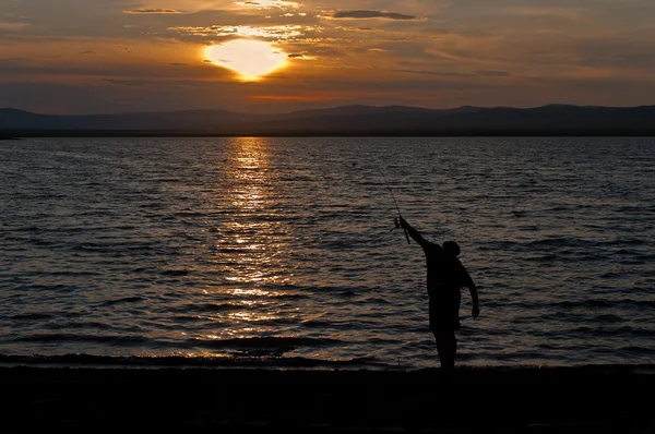 son ışınları güneş deniz kıyısında balık adam
