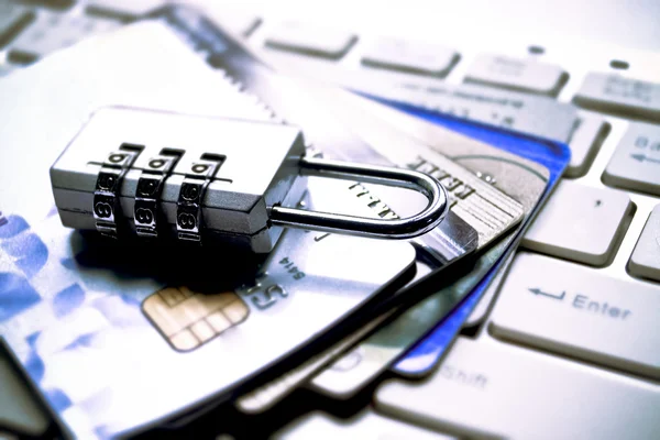 Lock and credit cards on keyboard — Stock Photo, Image