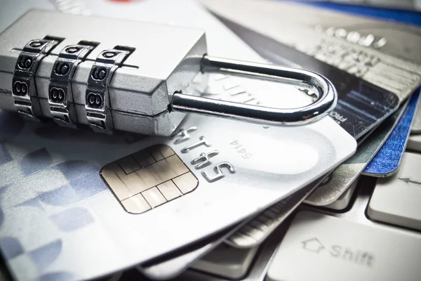 Lock and credit cards on keyboard — Stock Photo, Image