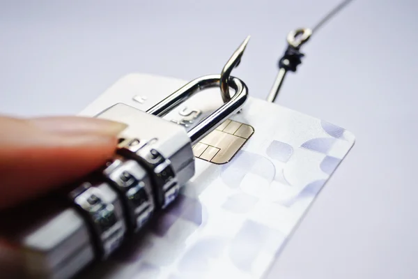 Lock and card in hand  on hook — Stock Photo, Image