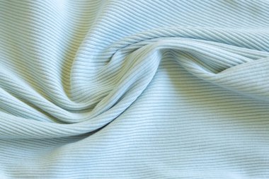 Açık yeşil, mavi, nane renginde tırtıklı pamuk kumaş. Kapatın. Pamuk giysi ve tekstil. Doğal organik kumaş dokusu.