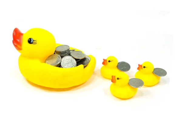 Rubber duck and coin — Stock Photo, Image