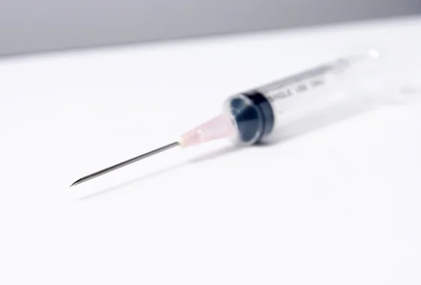 Close-up of medical syringe on white background — Stock Photo, Image