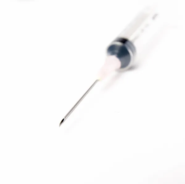 Close-up of medical syringe on white background — Stock Photo, Image