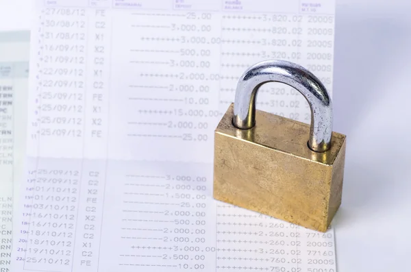 Lock and key on passbook — Stock Photo, Image