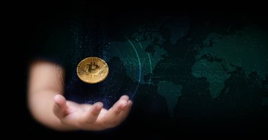 Hand of woman holding  Bit coin with HUD network and futuristic technology concept