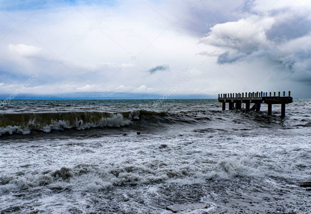 severe storm at sea, destroyed pier