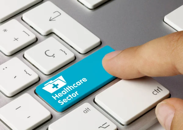 Healthcare Sector Written Blue Key Metallic Keyboard Finger Pressing Key — Stock Photo, Image