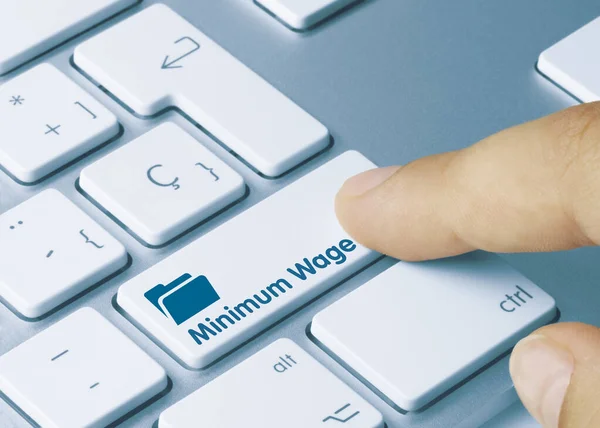 Minimum Wage Written Blue Key Metallic Keyboard Finger Pressing Key — Stockfoto