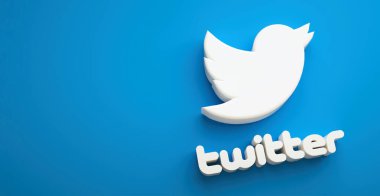 Valencia, İspanya - Ekim 2021: Akıllı telefonlar için izole edilmiş twitter logo kuşu simgesi mavi arkaplan fotokopi alanı üzerinde 3D görüntüleme. Mikroblog yazma ve mesajları paylaşma için ücretsiz sosyal medya ağı uygulaması
