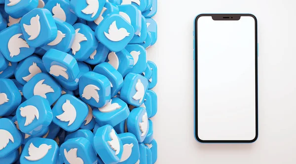 Valencia, İspanya - Ekim 2021: Cep telefonlu ve boş ekranlı bir sürü Twitter uygulama simgesi. Twitter, mikroblog yazma ve mesajları paylaşma için ücretsiz bir sosyal medya ağı uygulaması
