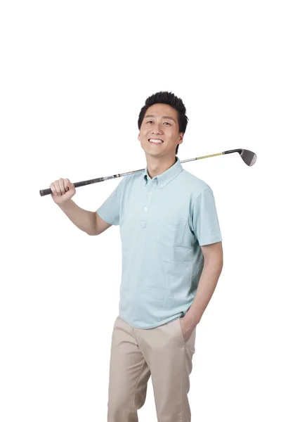 Молода людина, що гра в гольф — стокове фото