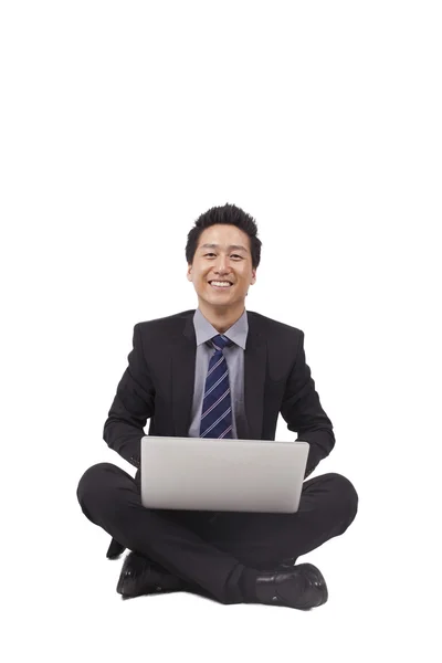 Young Businessman using laptop — Stock Photo, Image