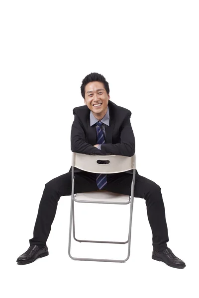 Empresário sentado postura — Fotografia de Stock