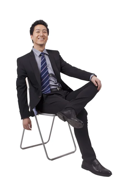 Geschäftsmann in Sitzhaltung — Stockfoto