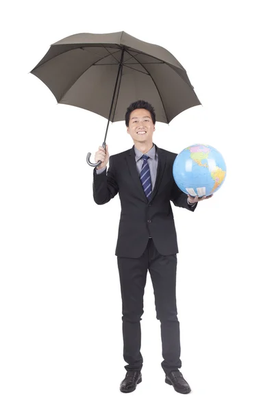 Empresário segurando globo — Fotografia de Stock