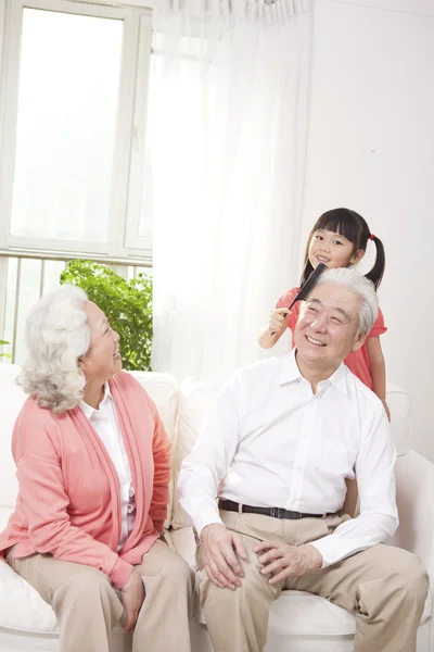 Couple with granddaughter — Stock Photo, Image