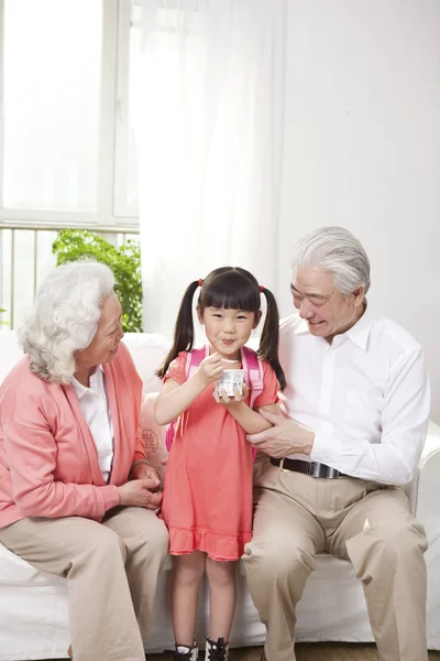 Couple with granddaughter — Stock Photo, Image