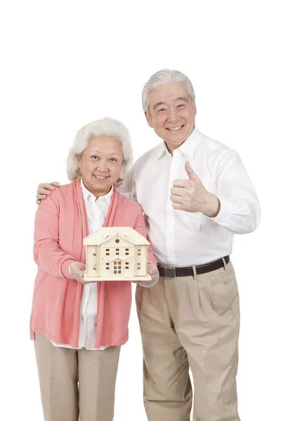 Couple holding building model — Stock Photo, Image