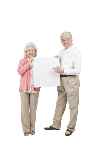 Couple holding white board — Stock Photo, Image
