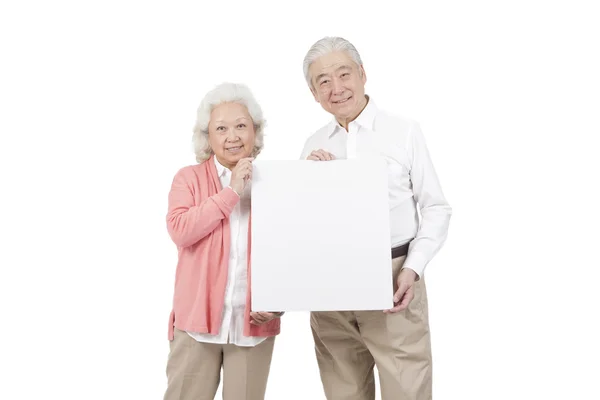 Couple holding white board — Stock Photo, Image