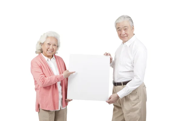 Couple holding white board — Stock Photo, Image