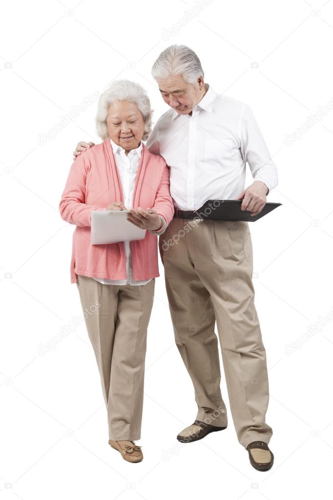 Couple holding questionnaire