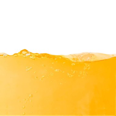 Yellow water surface with splash and air bubbles .