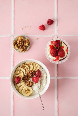 rice porridge with banana and raspberries. High quality photo clipart