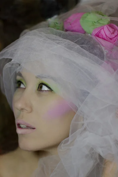 Girl in white veil with rose and green flowers — Stock Photo, Image