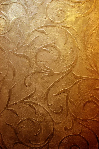 Mönster på en guld bakgrund. Stockbild
