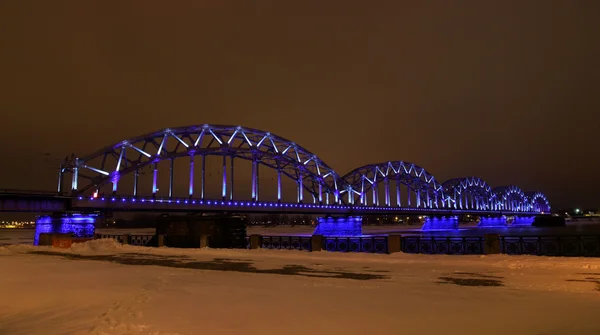Illuminated railroad bridge — Stock Photo, Image