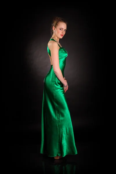 Young slim girl in green dress — Stock Photo, Image