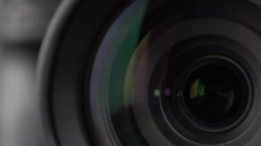 Macro Shot of Camera Lens with Flare on Optical Glass. Process of Zooming Camera Lens