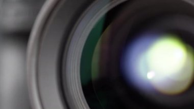 Macro Shot of Camera Lens with Flare on Optical Glass. Process of Zooming Camera Lens