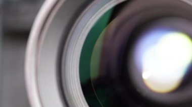 Macro Shot of Camera Lens with Flare on Optical Glass. Process of Zooming Camera Lens