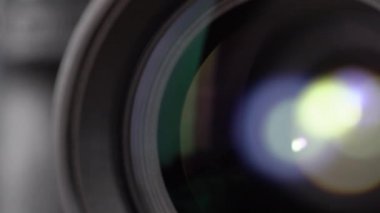 Macro Shot of Camera Lens with Flare on Optical Glass. Process of Zooming Camera Lens