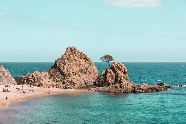 rocky coast landscape with beach and sea. Summer on the remote beach