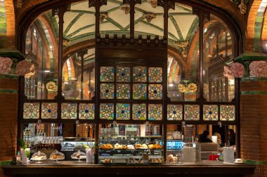 Barcelona, Spain - April 19 2022: Cafe with big decorated glass window in Palau de la Musica Opera in Barcelona, Spain