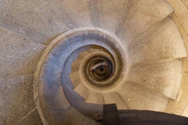 Top view of the spiral staircase in the tower. Walking down old the winding stairs