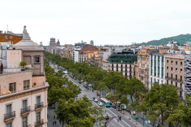 Barcelona, Spain - April 19 2022: Exterior view of old architecture in central part of Barcelona, Spain. Colorful houses, buildings.