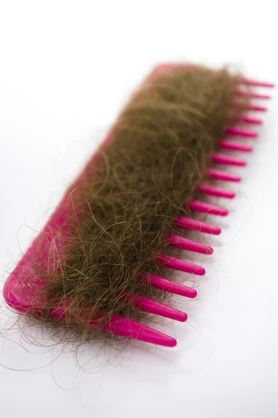 Hair on a pink comb. — Stock Photo, Image